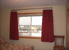 These specialty brackets have no center support.  The drapery can be side stacked or split stacked or center stacked